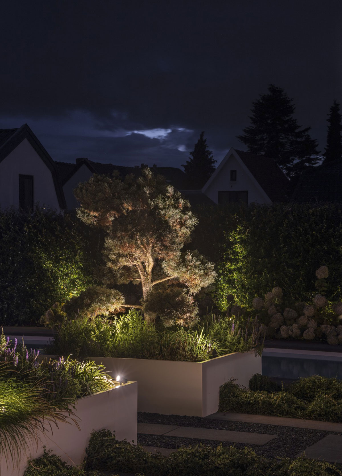 Elegant garden featuring Maretti Black Tie outdoor lights and stylish fixtures